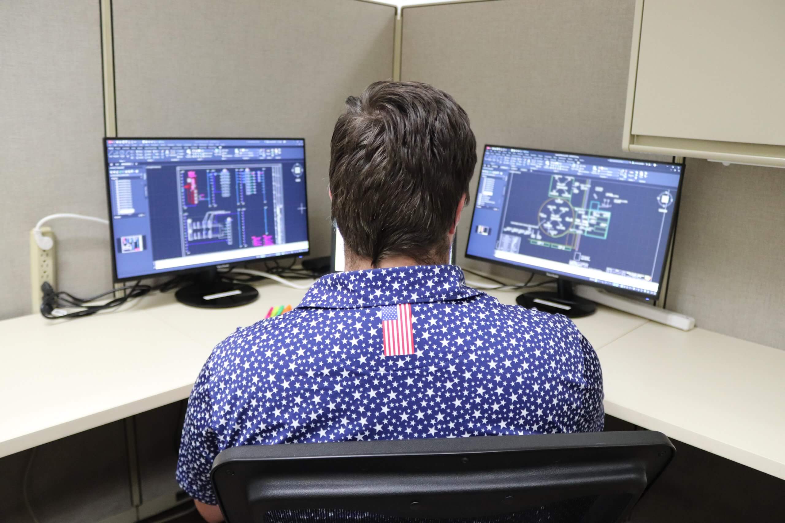 Engineer designing custom conveyor system using CAD software at Webb-Stiles