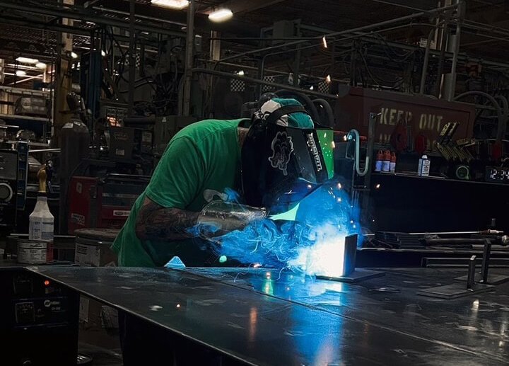 Webb-Stiles fabricator welding a custom conveyor component in-house