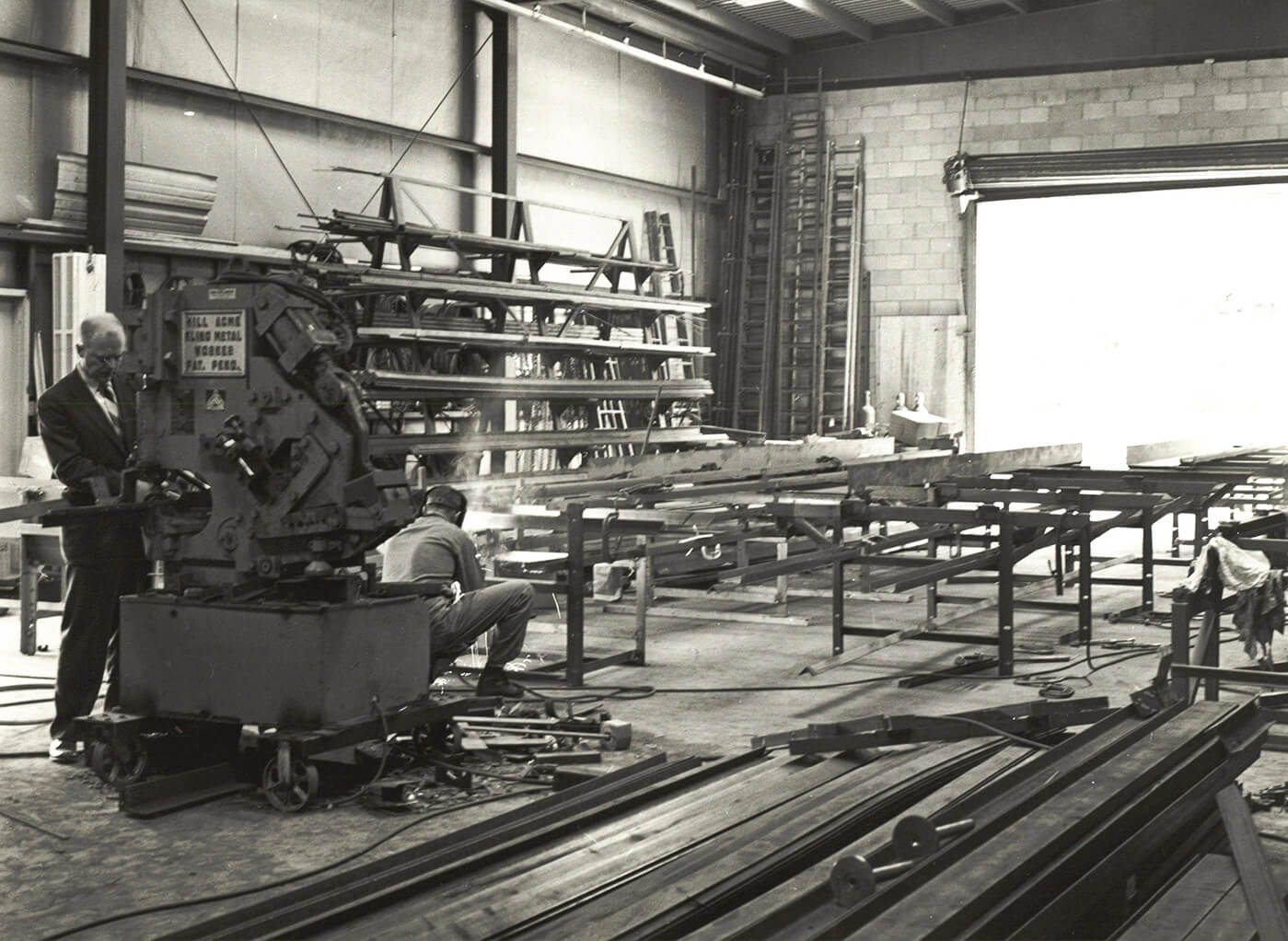 Black and white photo of Joe Webb and Don Stiles in the original Cleveland Flats facility