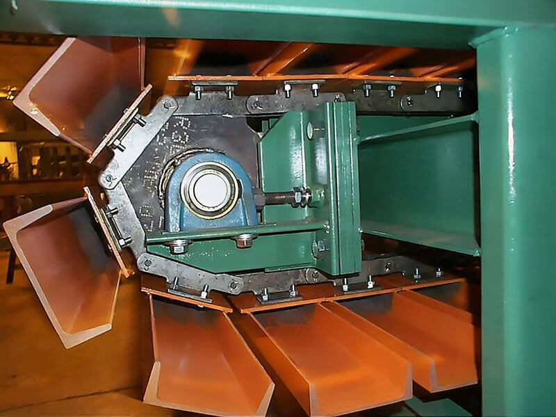 Heavy-duty slat conveyor by Webb-Stiles with close-up of center drive and precision bearing assembly