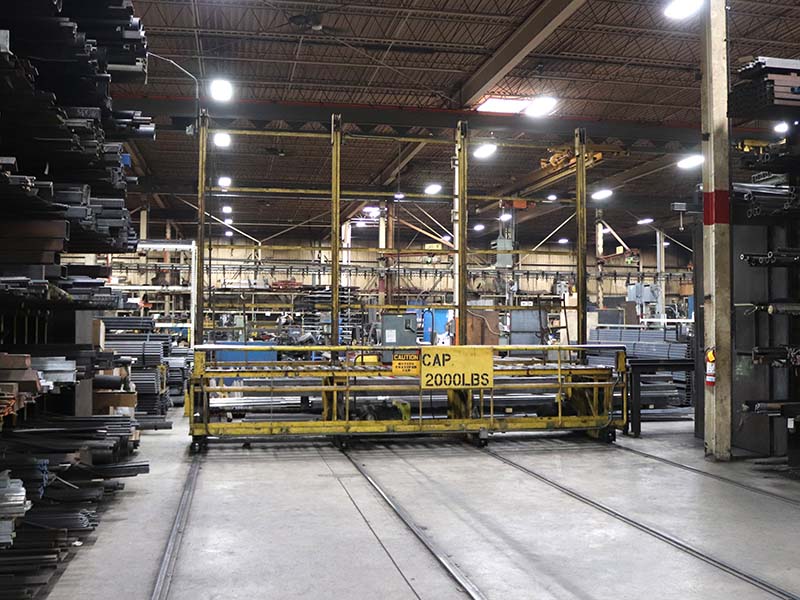 Webb-Stiles rail-guided transfer car moving heavy materials on a shop floor