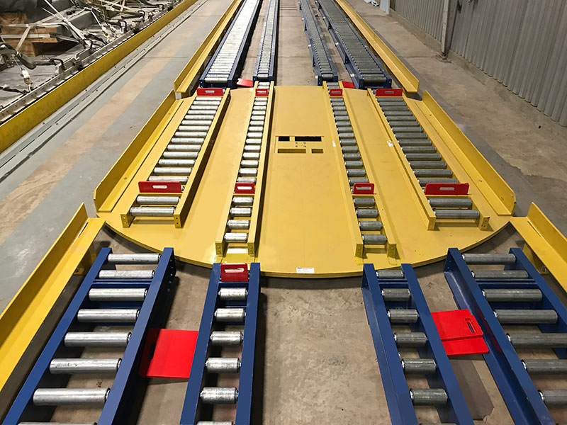 Webb-Stiles turntable conveyor with chain-driven live rollers for directional pallet transfer