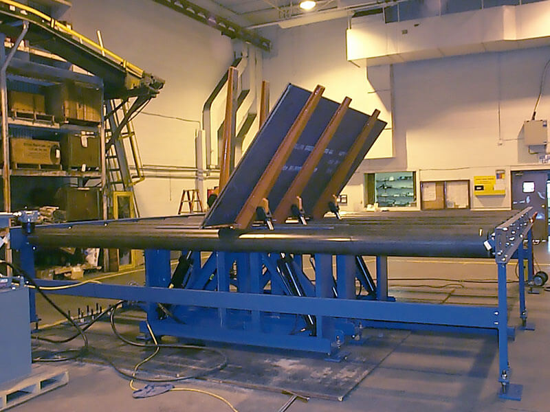 Upender with CDLR Conveyor in Testing Phase – Valley City Facility Upender mounted on CDLR conveyor during testing at Webb-Stiles’ Valley City shop