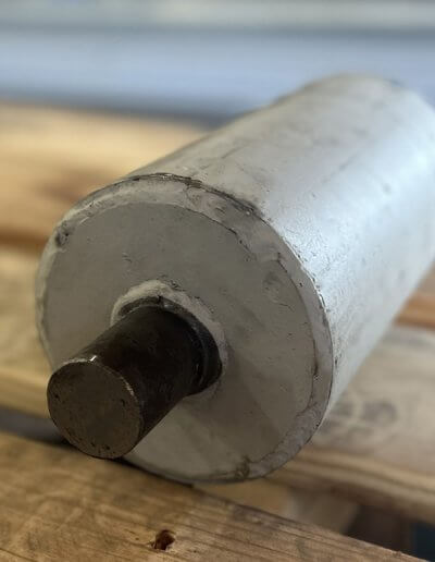 5-inch custom conveyor roller with precision welds and snap ring grooves for bearing retention.